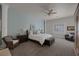 Cozy main bedroom with a ceiling fan and large window allowing for natural light at 1901 Rosemere Ct, Las Vegas, NV 89117