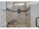 Modern shower with a built-in bench, sleek tile work, and a glass enclosure at 1901 Rosemere Ct, Las Vegas, NV 89117