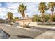 Street view showing the entrance to Remeere Estates with stately palm trees and a secure gated entry for privacy at 1901 Rosemere Ct, Las Vegas, NV 89117