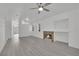 Bright, open living area featuring a modern fireplace, ceiling fan, and light gray floors at 2218 Ramsgate Dr # 0, Henderson, NV 89074