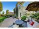 Enjoy this backyard featuring a patio area with a fire pit and lots of privacy at 2236 Midvale Ter, Henderson, NV 89074