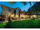 Expansive backyard featuring a lush lawn, mature trees, and a charming gazebo, perfect for outdoor relaxation and entertainment at 2236 Midvale Ter, Henderson, NV 89074