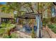 Covered pergola features blue curtains, table with seating, and paver flooring at 2236 Midvale Ter, Henderson, NV 89074