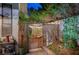 Enchanting backyard gate leading to a lush garden, adding privacy and charm to the outdoor space at 2236 Midvale Ter, Henderson, NV 89074