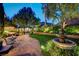 Stone patio with fountain, gazebo and dining area in landscaped backyard at 2236 Midvale Ter, Henderson, NV 89074