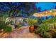 Inviting backyard with a charming gazebo dining area, lush landscaping, and a relaxing atmosphere at 2236 Midvale Ter, Henderson, NV 89074