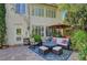 Cozy outdoor living area with comfortable seating, a fire pit, and a well-manicured patio at 2236 Midvale Ter, Henderson, NV 89074