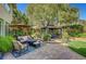 Inviting backyard with a gazebo, comfortable seating, and a fire pit for relaxation at 2236 Midvale Ter, Henderson, NV 89074