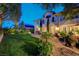 Expansive backyard with lush lawn, mature trees, and a spacious patio perfect for outdoor entertaining and relaxation at 2236 Midvale Ter, Henderson, NV 89074