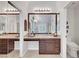 Bathroom vanity with a granite countertop, large mirror, and modern fixtures at 2236 Midvale Ter, Henderson, NV 89074