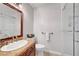 Bathroom with granite countertops, updated vanity and modern glass shower at 2236 Midvale Ter, Henderson, NV 89074
