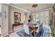 Formal dining room featuring a chandelier, elegant furnishings, wainscoting and french doors at 2236 Midvale Ter, Henderson, NV 89074