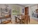 Eat in kitchen and dining space featuring wood floors, wooden table and chairs, and a built in at 2236 Midvale Ter, Henderson, NV 89074