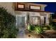 Inviting front entrance with landscaped yard, walkway, and double front door at 2236 Midvale Ter, Henderson, NV 89074