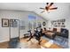 This home gym has laminate floors, a ceiling fan, and plenty of natural light at 2236 Midvale Ter, Henderson, NV 89074
