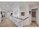 Upstairs hallway with carpet, white walls, white railing, and recessed lighting at 2236 Midvale Ter, Henderson, NV 89074
