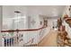 Upstairs hallway with carpet and railing at 2236 Midvale Ter, Henderson, NV 89074