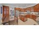 Modern kitchen with stainless steel appliances, granite countertops, and dark wood cabinetry offers a gourmet cooking experience at 2236 Midvale Ter, Henderson, NV 89074