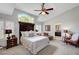 Inviting main bedroom featuring vaulted ceilings and arched window for natural lighting at 2236 Midvale Ter, Henderson, NV 89074