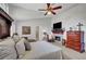 Spacious main bedroom with a fireplace, vaulted ceiling, and comfortable sitting area at 2236 Midvale Ter, Henderson, NV 89074