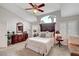 Bright main bedroom featuring vaulted ceilings, arched window, and plantation shutters at 2236 Midvale Ter, Henderson, NV 89074