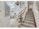 Open staircase featuring carpeted steps, white railings, and tile flooring at 2236 Midvale Ter, Henderson, NV 89074