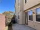 Private backyard area with stucco wall and mature landscaping at 2461 Brooklyn Bridge St, Las Vegas, NV 89135