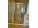 Bathroom showcasing a glass-enclosed shower with tiled walls at 2461 Brooklyn Bridge St, Las Vegas, NV 89135