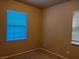 Bedroom with two windows and neutral carpeting at 2461 Brooklyn Bridge St, Las Vegas, NV 89135