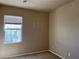 Neutral bedroom with a window providing natural light at 2461 Brooklyn Bridge St, Las Vegas, NV 89135