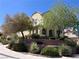 Well-maintained two-story home with lush landscaping and a terraced front yard at 2461 Brooklyn Bridge St, Las Vegas, NV 89135