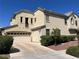 Spacious home with a three-car garage and well-maintained landscaping at 2461 Brooklyn Bridge St, Las Vegas, NV 89135
