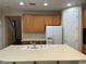 Well-lit kitchen with a large center island and modern appliances at 2461 Brooklyn Bridge St, Las Vegas, NV 89135