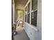 Covered porch showcasing stone accents and a view of the landscaped yard at 2461 Brooklyn Bridge St, Las Vegas, NV 89135