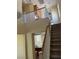 Elegant staircase leading to the upper level with views of the open floor plan at 2461 Brooklyn Bridge St, Las Vegas, NV 89135
