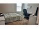 Cozy bedroom with a desk, carpet flooring, and natural light, ideal for relaxation and study at 2629 Monte Cevedale St, Henderson, NV 89044