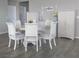 Elegant dining room featuring a round table, six chairs and ample storage at 2629 Monte Cevedale St, Henderson, NV 89044