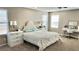 Comfortable main bedroom features carpeted floors, a ceiling fan, and a dedicated workspace with a white desk at 2629 Monte Cevedale St, Henderson, NV 89044