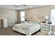 Spacious main bedroom features a comfortable bed, side tables with lamps, and carpeted flooring at 2629 Monte Cevedale St, Henderson, NV 89044