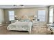 Spacious main bedroom featuring a plush bed, ceiling fan, and abundant natural light from multiple windows at 2629 Monte Cevedale St, Henderson, NV 89044
