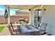 Covered patio features a built-in BBQ area and comfortable seating for outdoor dining at 2629 Monte Cevedale St, Henderson, NV 89044