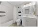 Bright bathroom with a shower-tub combo, modern vanity, and neutral finishes at 2637 Rialto Rd, Las Vegas, NV 89108