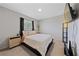 A bedroom featuring a king-size bed, neutral tones, and a TV for relaxing at 2637 Rialto Rd, Las Vegas, NV 89108