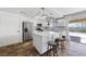 Updated kitchen featuring stainless steel appliances, quartz countertops, and a center island with seating at 2637 Rialto Rd, Las Vegas, NV 89108