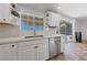 Modern kitchen featuring white cabinets, stainless steel appliances, and quartz countertops at 2637 Rialto Rd, Las Vegas, NV 89108