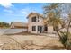 The backyard offers a spacious area with potential for landscaping and outdoor activities, complemented by the home's stucco exterior at 2802 Secret Canyon Rd, Las Vegas, NV 89074