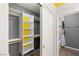 Organized closet space with built-in shelving and a view to the bathroom at 2802 Secret Canyon Rd, Las Vegas, NV 89074