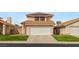 Charming two-story home features a two-car garage and well-maintained landscaping at 2802 Secret Canyon Rd, Las Vegas, NV 89074