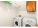 Convenient laundry room with modern appliances and overhead storage at 2802 Secret Canyon Rd, Las Vegas, NV 89074