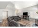 Inviting living room with vaulted ceiling, TV, and hardwood flooring at 2802 Secret Canyon Rd, Las Vegas, NV 89074